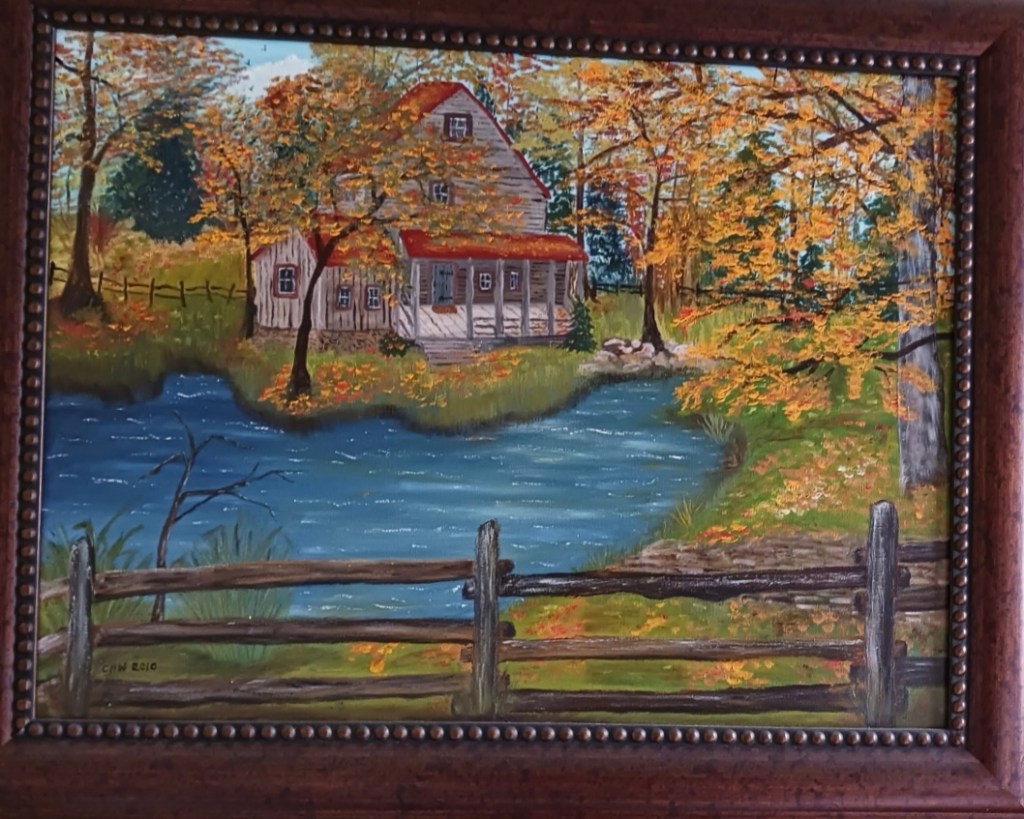 Painting of lakehouse with fall leaves